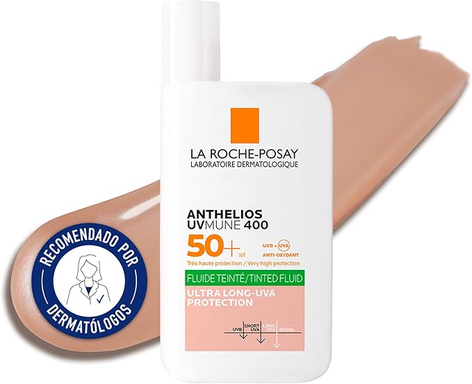 Tube of La Roche-Posay Anthelios Uvmune 400 Invisible Tinted Fluid SPF 50+ Sun Cream with a swatch of the tinted fluid next to it. The packaging indicates it is suitable for sensitive skin and provides ultra-long UVA protection.