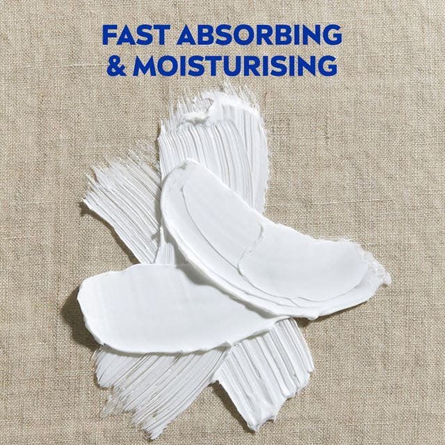 White cream smeared on a textured surface with the text 'Fast Absorbing & Moisturising' above it.